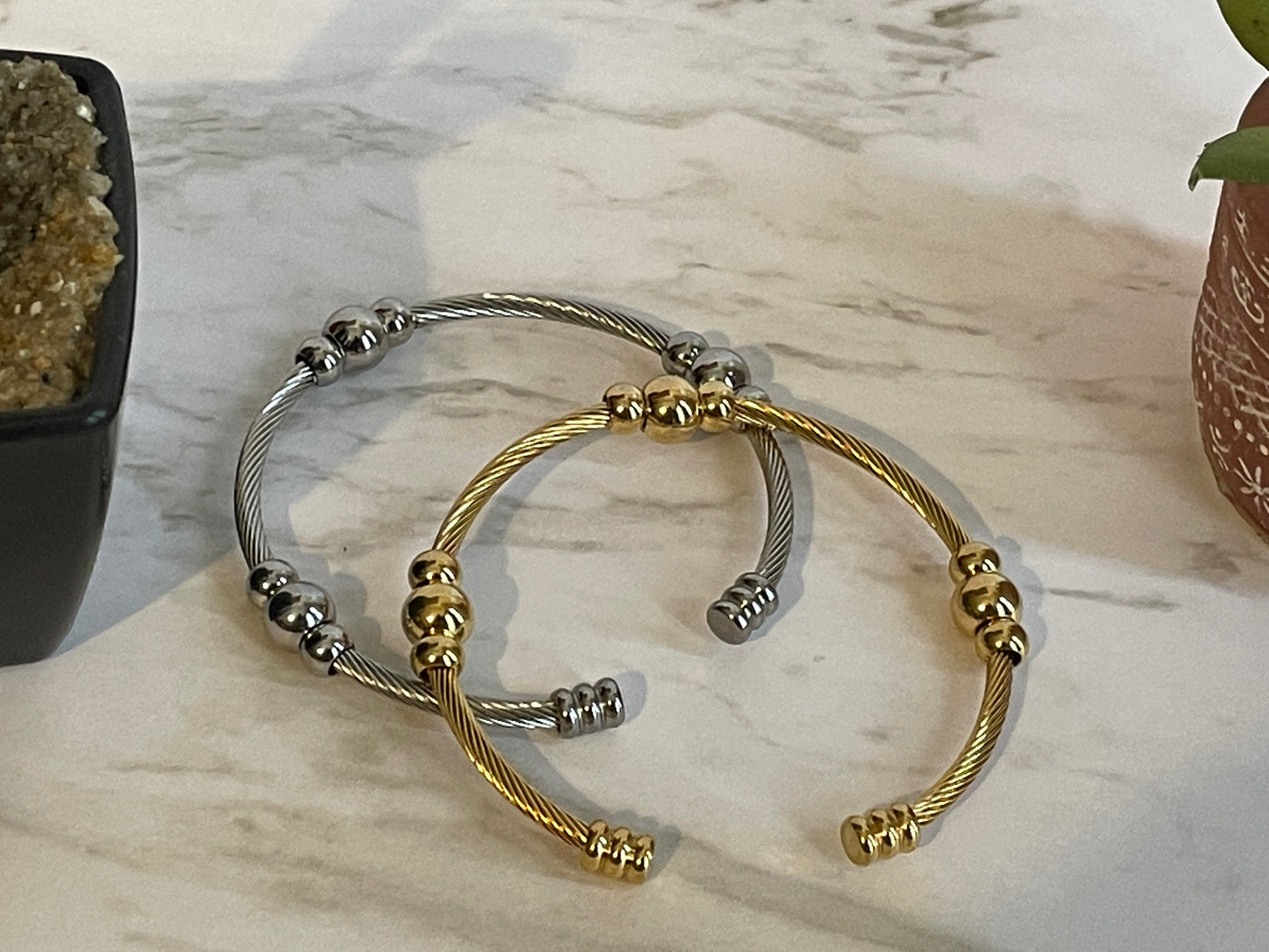 Adjustable stainless steel bangle